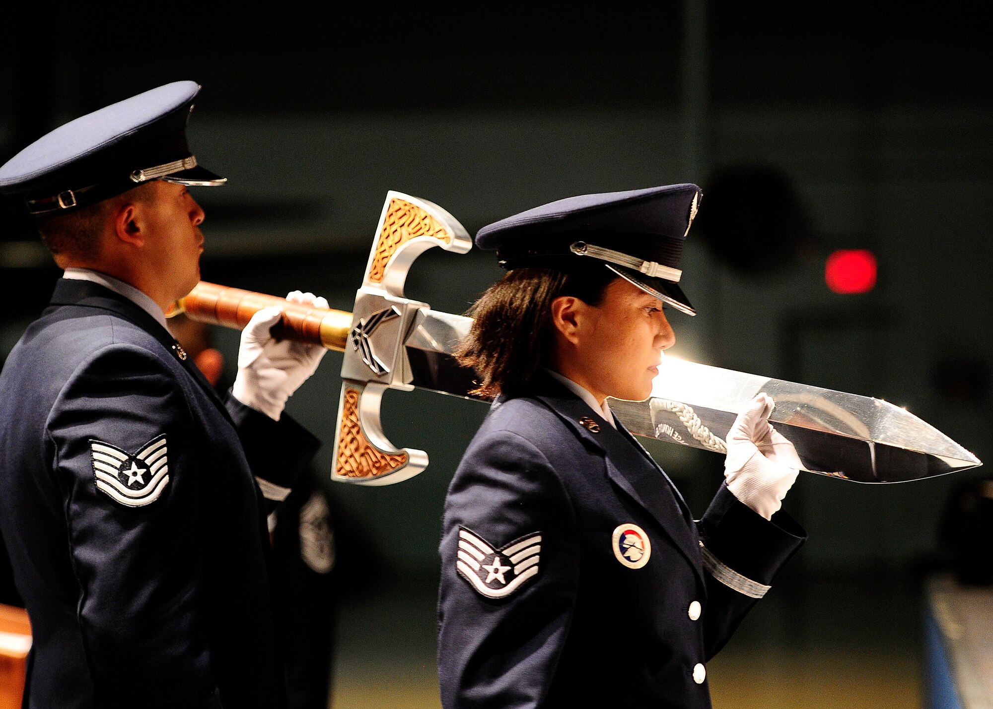 U.S. Air Force Honor Guard members Tech. Sgt. Juan Garcia and Staff Sgt. Annzen Salvador carry the sword used for the Order of the Sword ceremony at the Museum of Aviation in Warner Robins, Ga., July 13, 2016. The Order of the Sword is an honor awarded by the NCOs of a command to recognize individuals they hold in high esteem and for their contributions to the enlisted corps. (U.S. Air Force photo by Tech. Sgt. Stephen D. Schester)