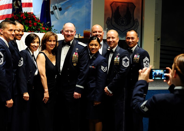 Former chief of Air Force Reserve Command, Lt. Gen. James F. Jackson and his wife poses for pictures with enlisted members before the Order of the Sword ceremony in his honor at the Museum of Aviation in Warner Robins, Ga, July 13, 2016. The Order of the Sword is an honor awarded by the NCOs of a command to recognize individuals they hold in high esteem and for their contributions to the enlisted corps. (U.S. Air Force photo by Tech. Sgt. Stephen D. Schester)