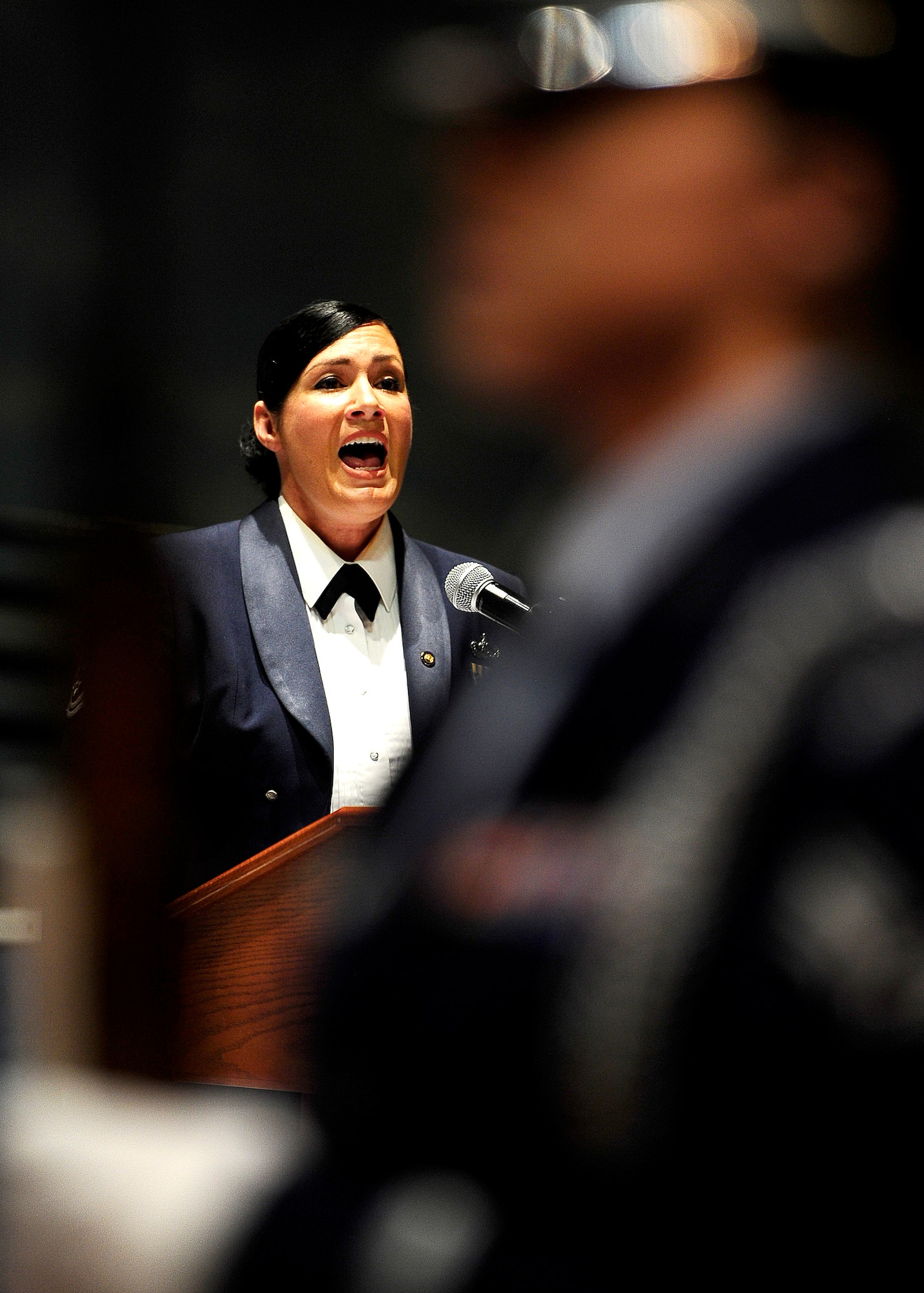 U.S. Air Force Tech. Sgt. Frances Kness (Ret) signs the national anthem before Order of the Sword ceremony at the Museum of Aviation in Warner Robins, Ga., July 13, 2016. The Order of the Sword is an honor awarded by the NCOs of a command to recognize individuals they hold in high esteem and for their contributions to the enlisted corps. (U.S. Air Force photo by Tech. Sgt. Stephen D. Schester)