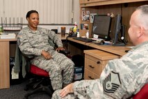 U.S. Air Force Reserve Senior Master Sgt. Lesia Brown, aviation resource superintendent, 327th Airlift Squadron, speaks with Master Sgt. Curtis Cline, superintendent of the 913th Force Support Squadron, at Little Rock Air Force Base, Ark., July 19, 2016. Brown’s responsibilities include tracking training for aircrews assigned to the 913th Airlift Group. (U.S. Air Force photo by Master Sgt. Jeff Walston)  