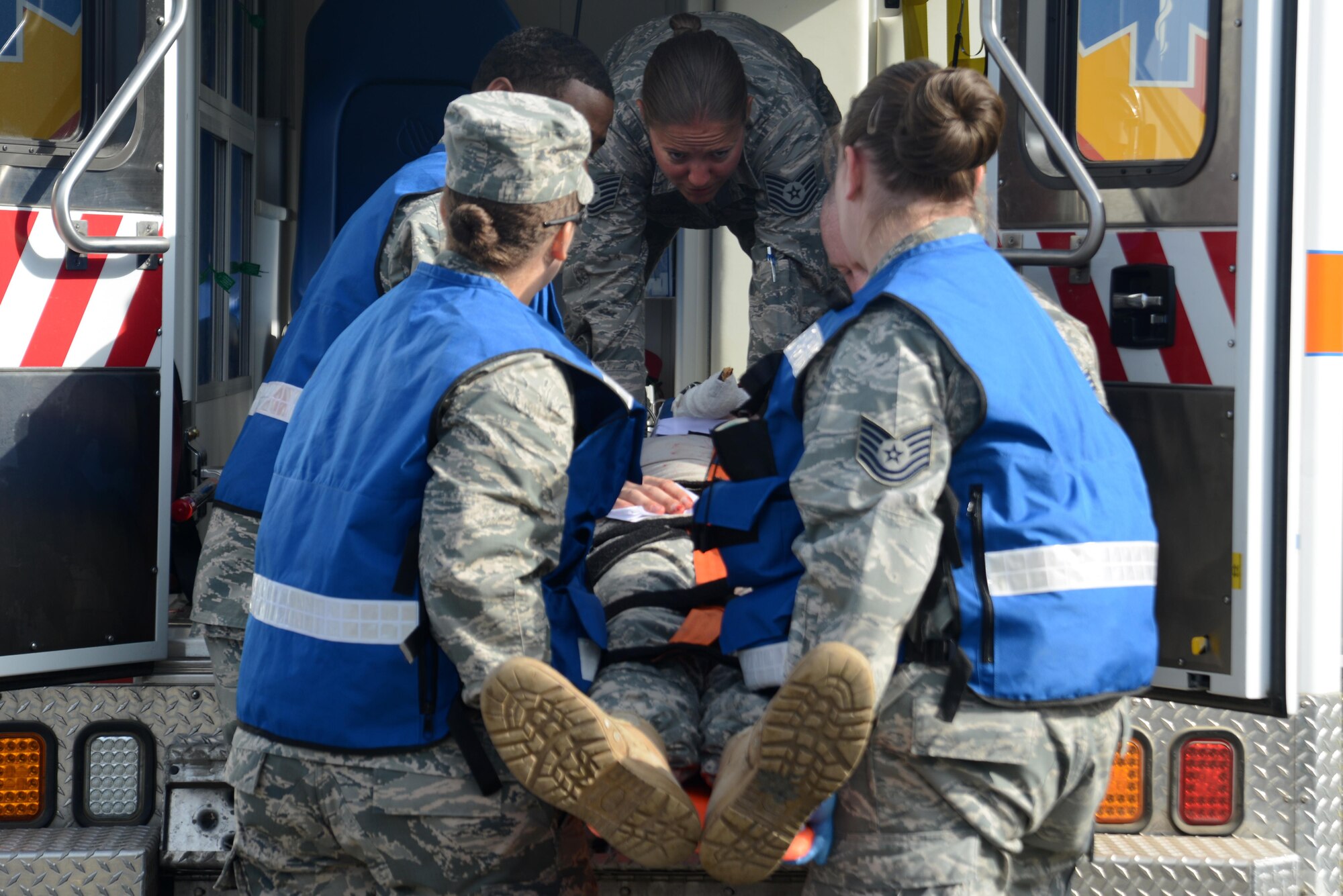 The Joint Base Elmendorf-Richardson hospital first responders load a simulated crash victim into an ambulance during Mission Assurance Exercise 16-7 at Joint Base Elmendorf-Richardson, Alaska, July 15, 2016. JBER simulated an aircraft crash to test the base’s ability to operate, coordinate and recover in an efficient and timely manner. (U.S. Air Force photo by Airman 1st Class Christopher R. Morales)