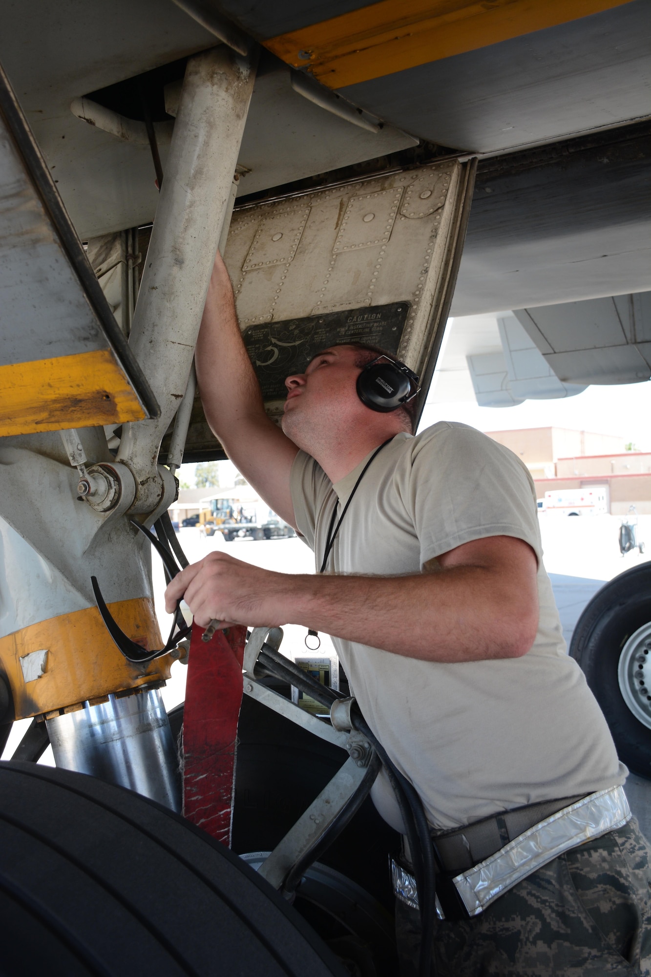 Senior Airman Nicholas Porter, 749th Aircraft Maintenance Squadron crew chief, performs maintenance checks July 15, 2016 after landing at Luke Air Force Base, Arizona. An aircrew of 70th Air Refueling Squadron members departed Travis Air Force Base, Calif., July 11, 2016 en route to Royal Air Force Base Fairford in Gloucestershire, England. The purpose of the trip is to refuel F-35A Lightning II jet fighters that are returning to the United States after participating in the world's largest air show. (U.S. Air Force photos by Staff Sgt. Madelyn Brown) 