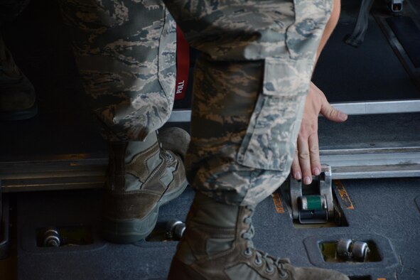At mission complete, the crew poses for a photo outside the KC-10 Extender on the Travis Air Force Base flightline July 16, 2016. An aircrew of 70th Air Refueling Squadron members departed Travis Air Force Base, Calif. July 11, 2016 en route to Royal Air Force Base Fairford in Gloucestershire, England. The purpose of the trip is to refuel F-35A Lightning II jet fighters that are returning to the United States after participating in the world's largest air show. (U.S. Air Force photos by Staff Sgt. Madelyn Brown) 