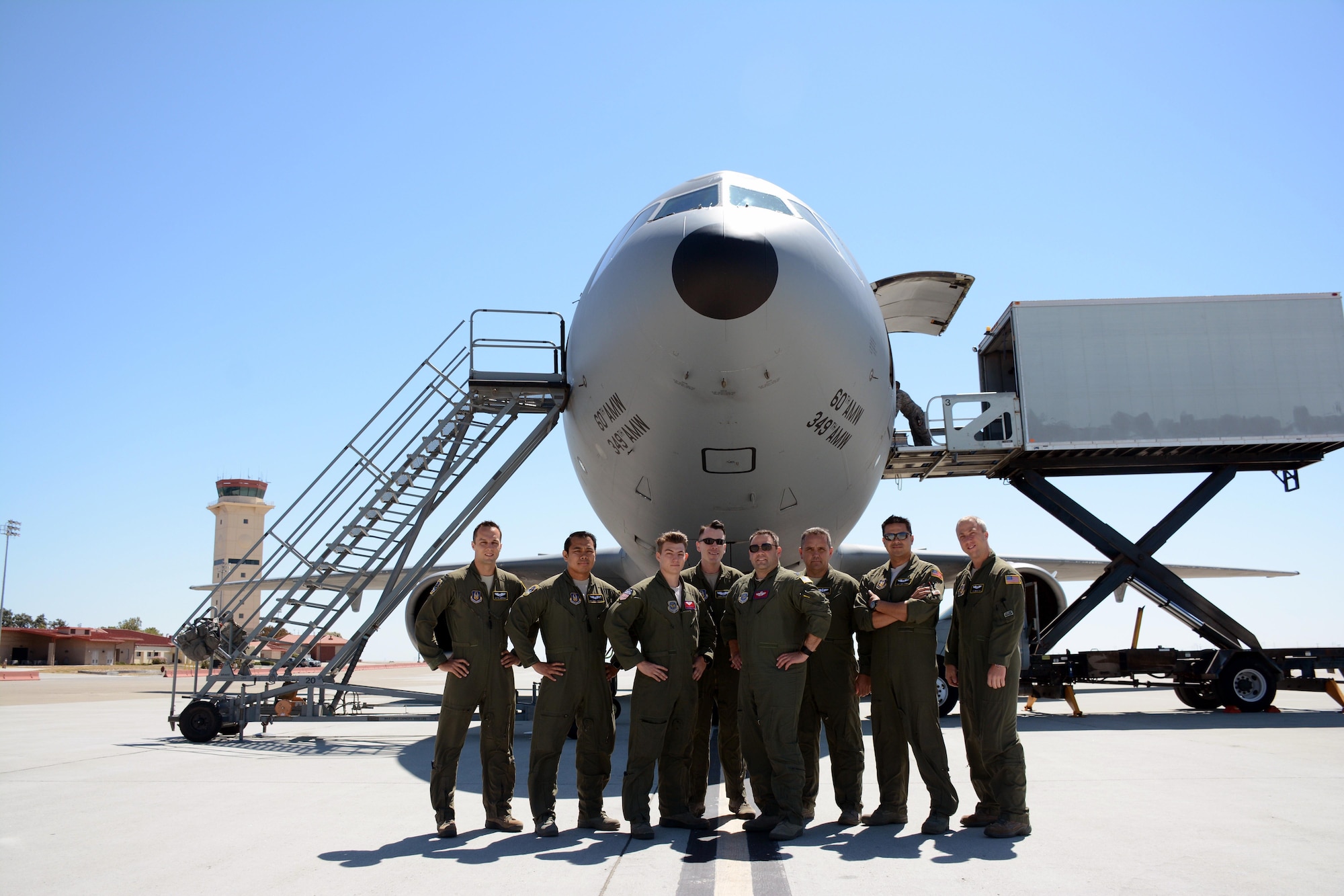 At mission complete, the crew poses for a photo outside the KC-10 Extender on the Travis Air Force Base flightline July 16, 2016. An aircrew of 70th Air Refueling Squadron members departed Travis Air Force Base, Calif. July 11, 2016 en route to Royal Air Force Base Fairford in Gloucestershire, England. The purpose of the trip is to refuel F-35A Lightning II jet fighters that are returning to the United States after participating in the world's largest air show. (U.S. Air Force photos by Staff Sgt. Madelyn Brown) 