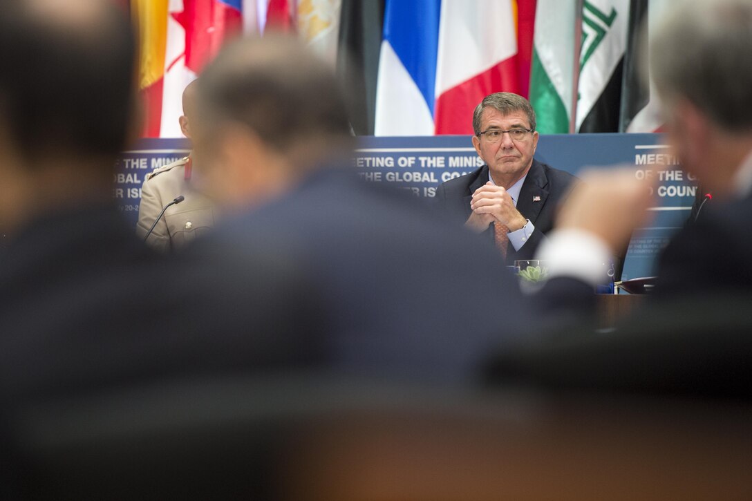 Defense Secretary Ash Carter listens to remarks from Secretary of State John Kerry  during a meeting of the coalition to counter the Islamic State of Iraq and the Levant in Washington, D.C., July 21, 2016. DoD photo by Air Force Tech. Sgt. Brigitte N. Brantley