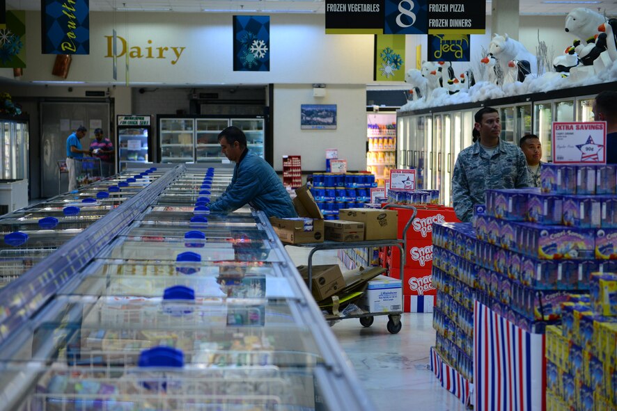 A commissary employee restocks freezer goods July 20, 2016, at Incirlik Air Base, Turkey. The Defense Commissary Agency provides goods to personnel at most base locations across the Department of Defense. (U.S. Air Force photo by Tech. Sgt. Caleb Pierce)