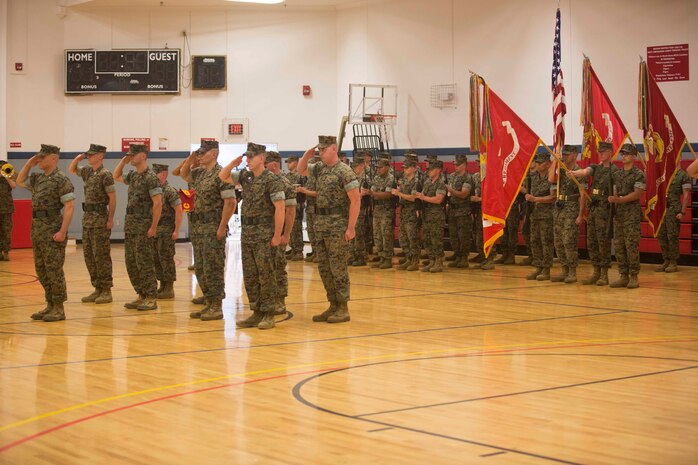 U.S. Marines render a salute for the national anthem during the 6th Marine Regiment Change of Command Ceremony on Camp Lejeune, N.C., May 3, 2016. U.S. Marine Corps Col. Calvert Worth, off going commanding officer, 6th Marine Regiment, 2nd Marine Division (2D MARDIV), relinquished command to Col. Matthew S. Reid, on coming commanding officer. (U.S. Marine Corps photo by Cpl. Alexander Hill, 2D MARDIV Combat Camera/Released)