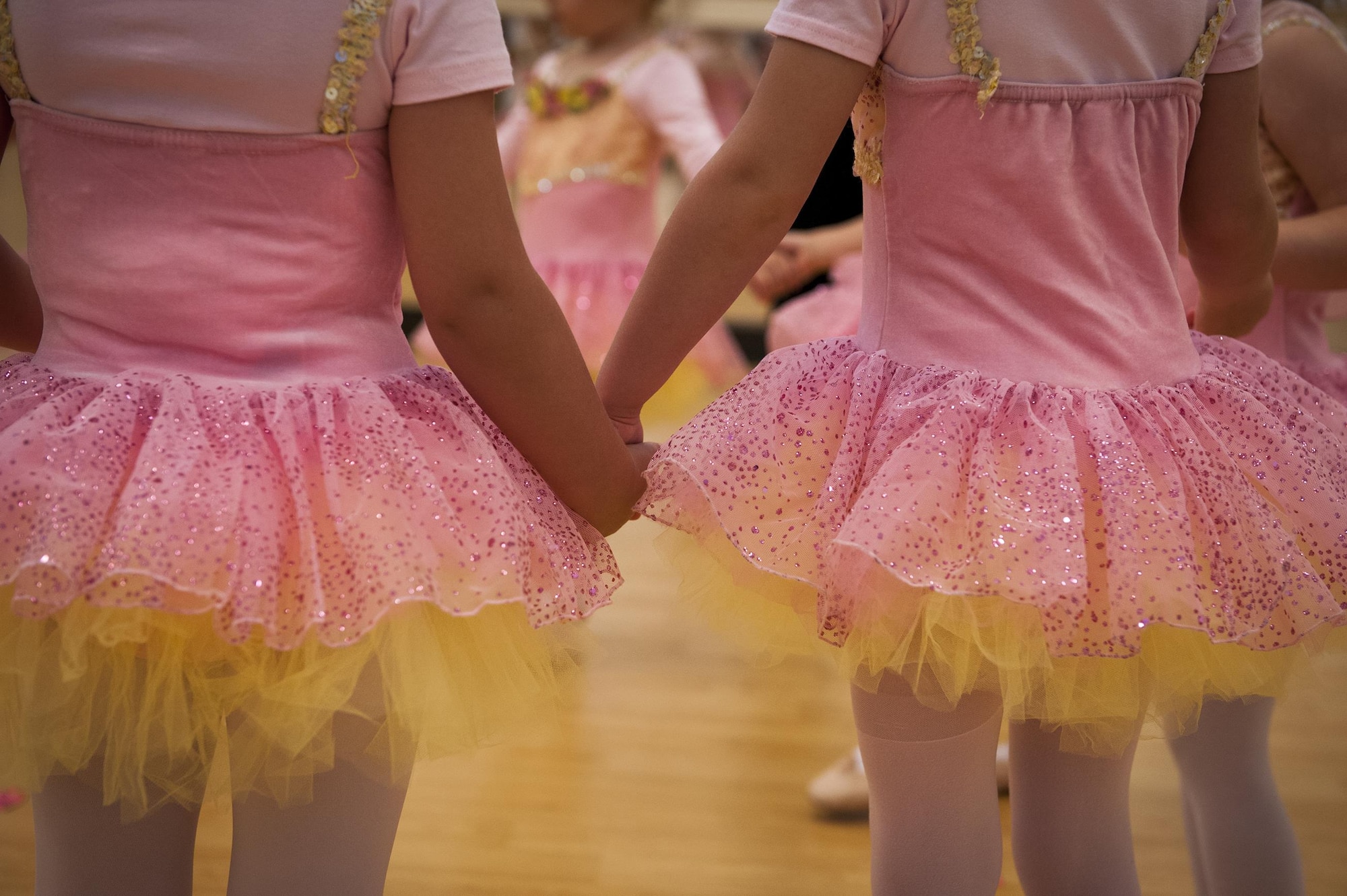 Dancers hold hands during a youth dance camp, July 20, 2016, at Moody Air Force Base, Ga. The class not only taught dancers ballet techniques, it also allowed children of the same age group to build friendships and learn how to share with each other. (U.S. Air Force photo by Airman 1st Class Lauren M. Hunter)