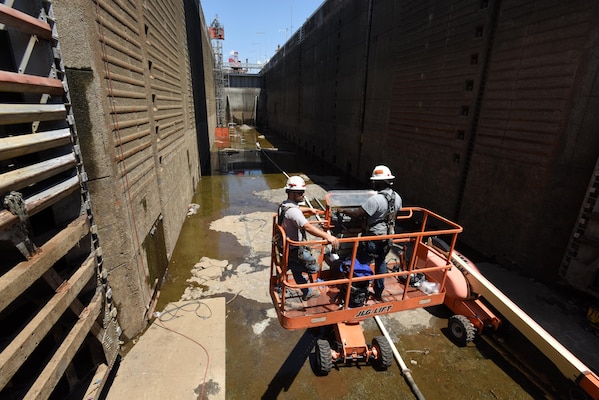 Lock and Dam Mechanics Alan Bailey (Right) and Ty Melton get into position to inspect and repair the downstream miter gate July 20, 2016 at Chickamauga Lock on the Tennessee River in Chattanooga, Tenn.  Bailey is from the Cumberland River Operations Center at Old Hickory, Tenn., and Melton is from the Tennessee River Operations Center at Florence, Ala. 