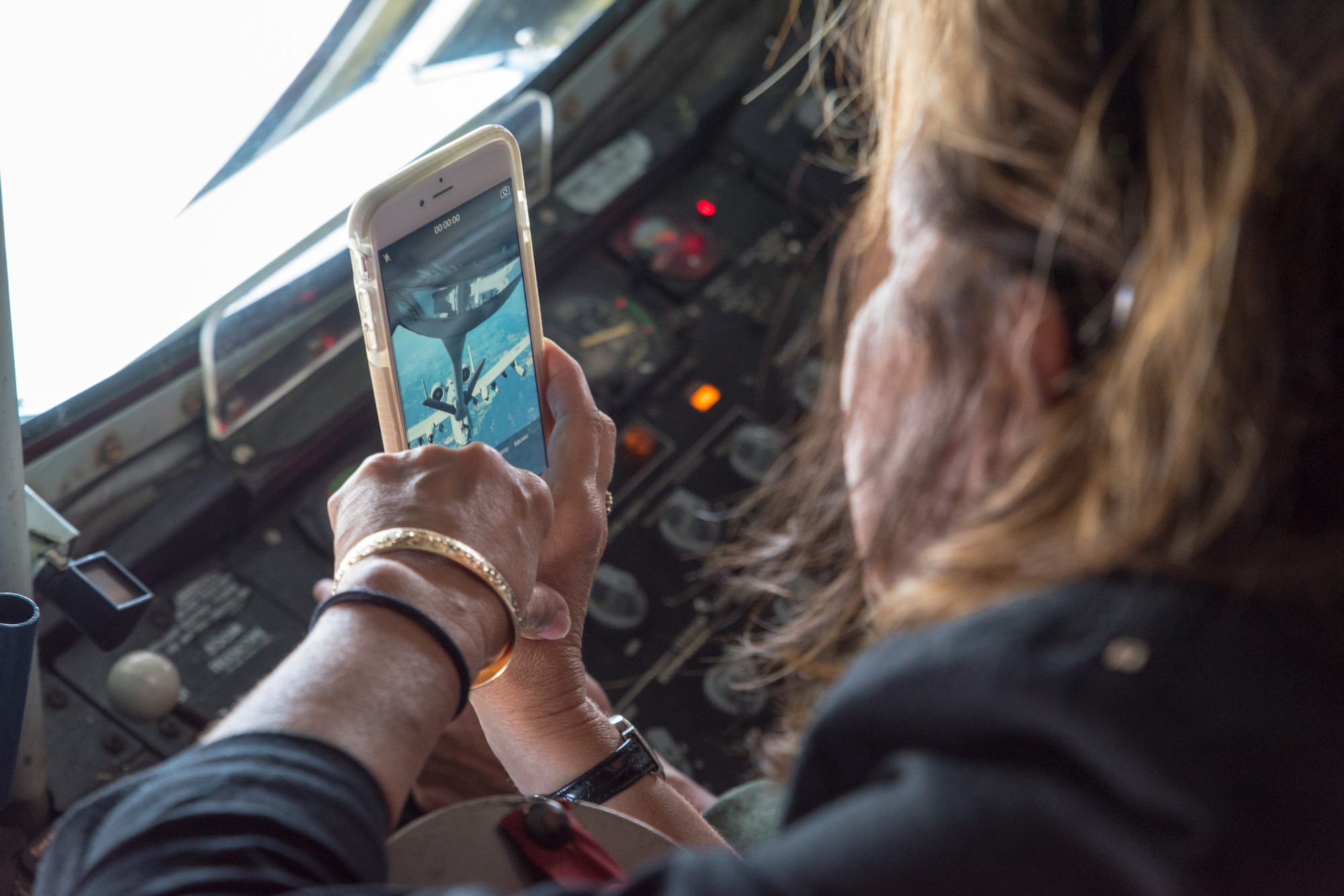 Mrs. Barabara Jackson, wife of Lt. Gen. James F. Jackson, former Chief of Air Force Reserve and commander of AF Reserve Command, captures the refueling of an A-10C Thunderbolt from the boom operator position in a KC-135 Stratotanker July 14, 2016. Jackson and other spouses were given an orientation flight as part of the AFRC commander and spouses conference at Robins Air Force Base, Georgia. (U.S. Air Force photo by Master Sgt. Eric J. Amidon)