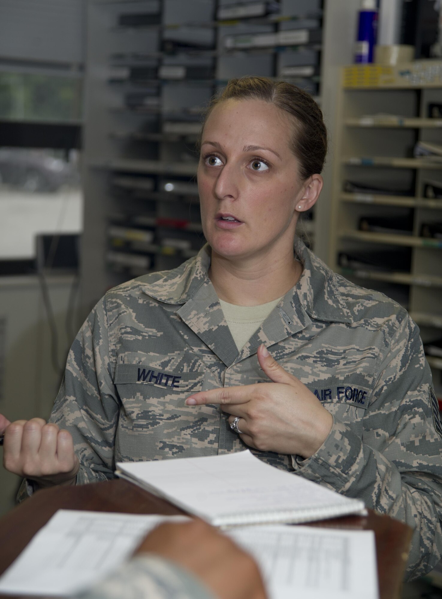 Tech. Sgt. Quinn White, 11th Logistics Readiness Squadron NCO in charge of vehicle operations, talks with Tech. Sgt. Louis Myers, 11th LRS chief dispatcher, about an Airman at Joint Base Andrews, Md., July 13, 2016. White spent four years as a military training leader for students attending the Defense Information School at Ft. Meade, Md., prior to be stationed at JBA. (U.S. Air Force photo by Rustie Kramer)