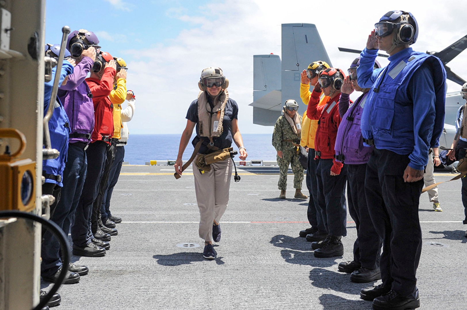 (July 18, 2016) - Undersecretary of the Navy Dr. Janine Davidson passes through the ceremonial rainbow sideboys as she arrives aboard the amphibious assault ship USS America (LHA 6) for a scheduled visit. America is underway conducting maritime exercises with partner nations for Rim of the Pacific 2016.  Twenty-six nations, more than 40 ships and submarines, more than 200 aircraft and 25,000 personnel are participating in RIMPAC from June 30 to Aug. 4, in and around the Hawaiian Islands and Southern California. The world's largest international maritime exercise, RIMPAC provides a unique training opportunity that helps participants foster and sustain the cooperative relationships that are critical to ensuring the safety of sea lanes and security on the world's oceans. RIMPAC 2016 is the 25th exercise in the series that began in 1971. 