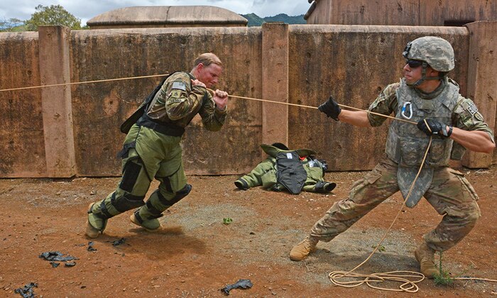 SCHOFIELD BARRACKS, Hawaii (July 20, 2016) - Team members from 65th Explosive Ordnance Disposal Company, 303rd EOD Battalion, 8th Military Police Brigade, 8th Theater Sustainment Command, pull on a rope to clear items from the trunk of a car that has an improvised explosive device inside during the U.S. Army-Pacific EOD Team of the Year competition, July 11-15. 