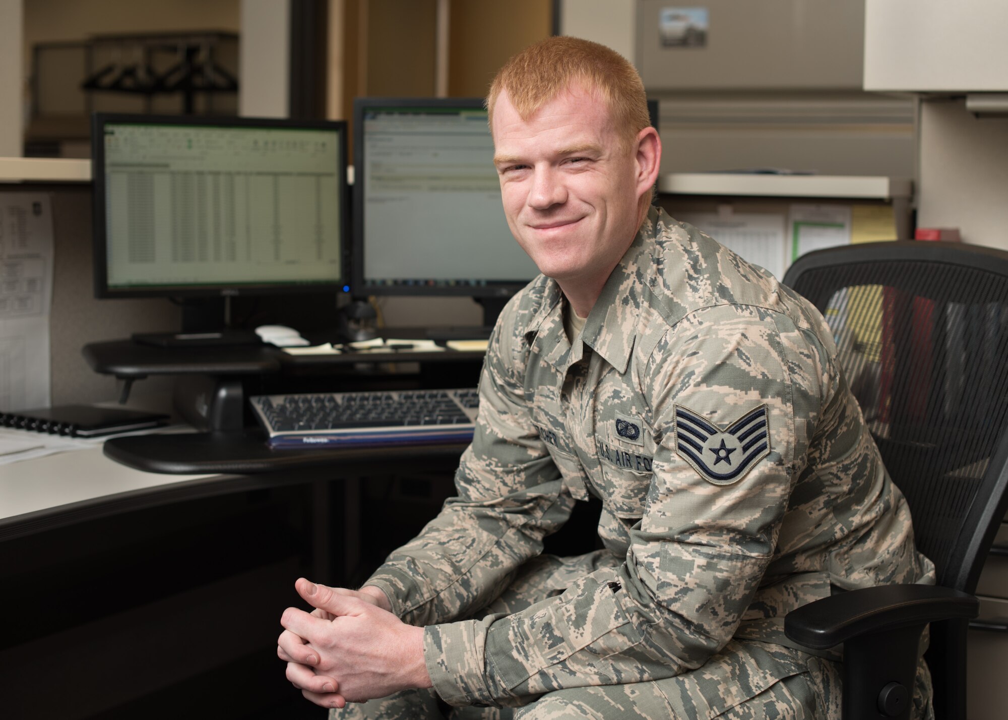 Staff Sgt. Kyle Fletcher, 349th Air Mobility Wing financial management specialist, knows that while his job requires a meticulous attention to detail that can become tedious, the results of his work impact people who count on his diligence. (U.S. Air Force photo by Ken Wright)