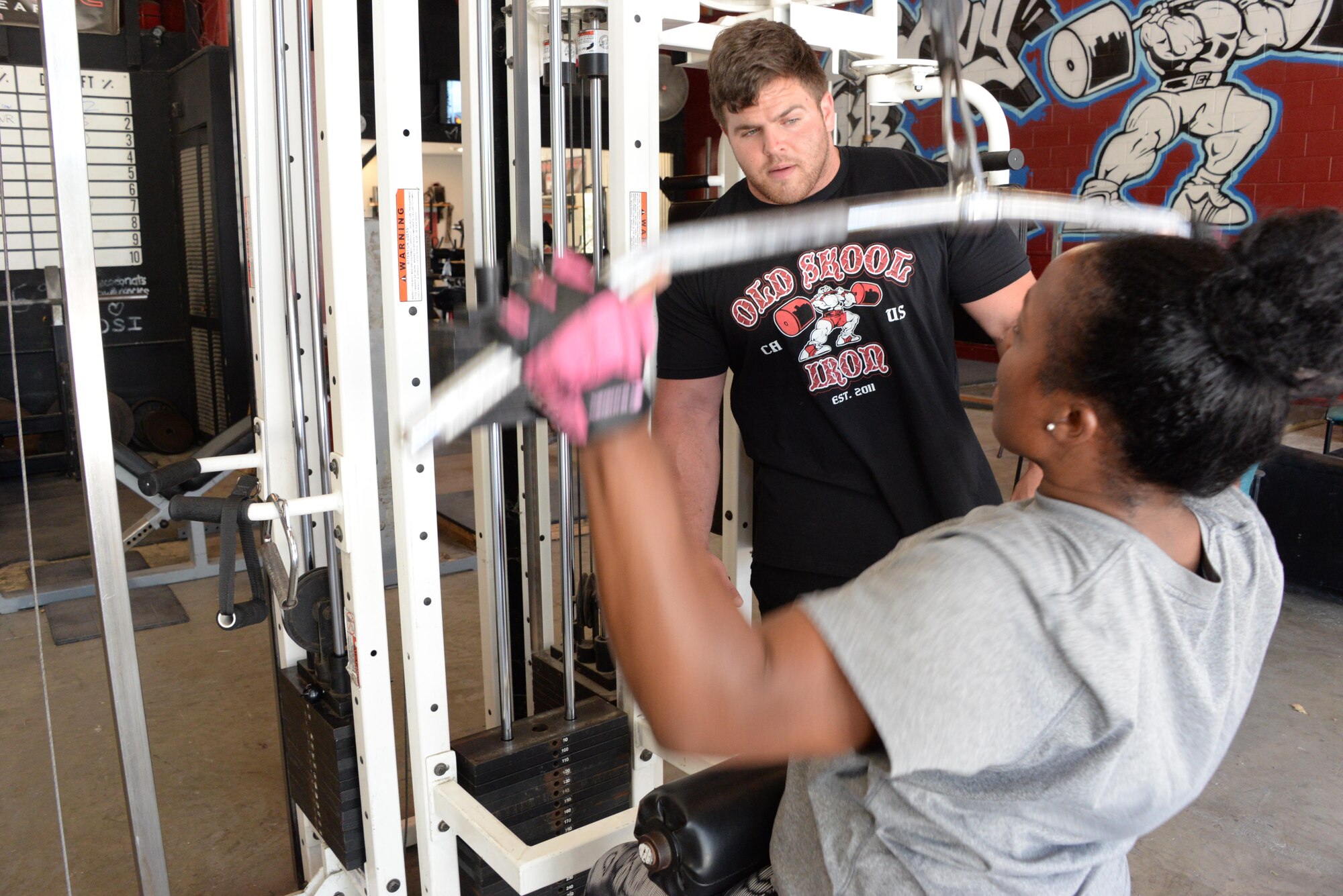 Staff Sgt. Tamika Hamilton, 60th Logistics Readiness Squadron customer service support, works out July 8 with her off-base trainer, Kevin Pulsipher. Hamilton changed her workout routine after giving birth in October 2015. 