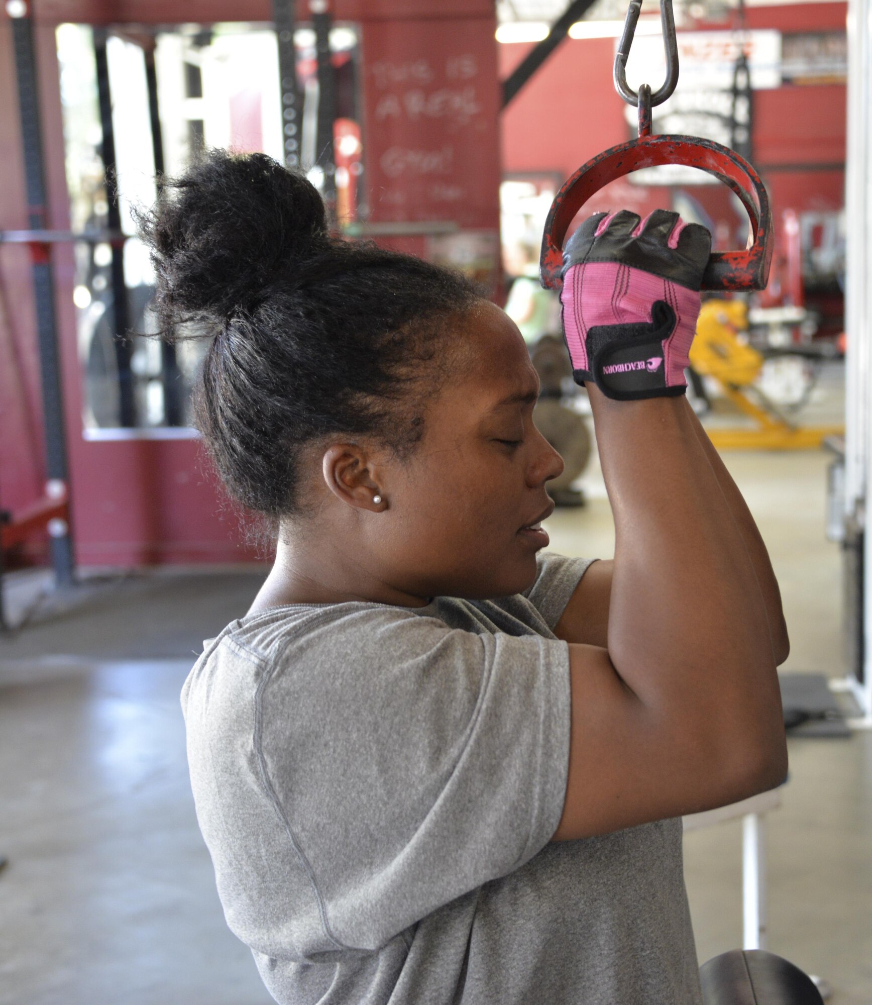 Staff Sgt. Tamika Hamilton, 60th Logistics Readiness Squadron customer service support, pushes herself July 8 during her new workout routine.