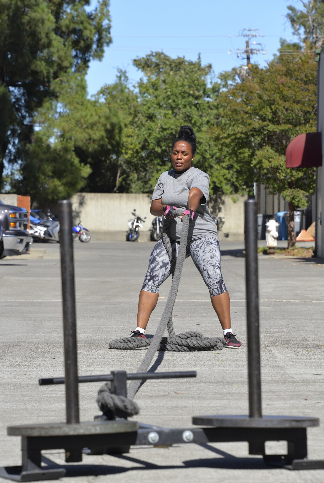 Staff Sgt. Tamika Hamilton, 60th Logistics Readiness Squadron customer service support, pushes herself July 8 during her new workout routine.