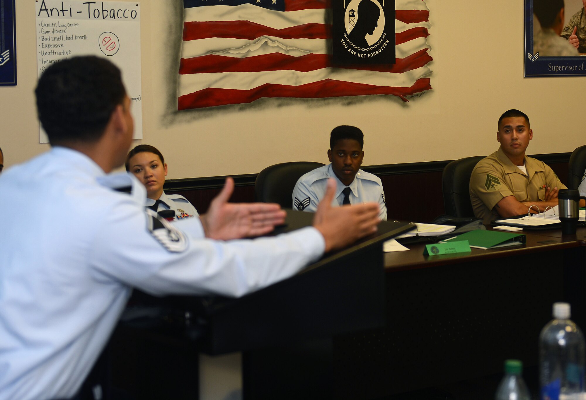 Master Sgt. Timur Kuzu (foreground), Julius A. Kolb Airman Leadership School commandant, explains course material to students during an ALS lecture July 18, 2016, at Joint Base Lewis-McChord, Wash. The ALS course consists of guided discussions, classroom methodology, experimental activities, exercises and case studies to teach students leadership and NCO requirements. (U.S. Air Force photo/Senior Airman Jacob Jimenez) 