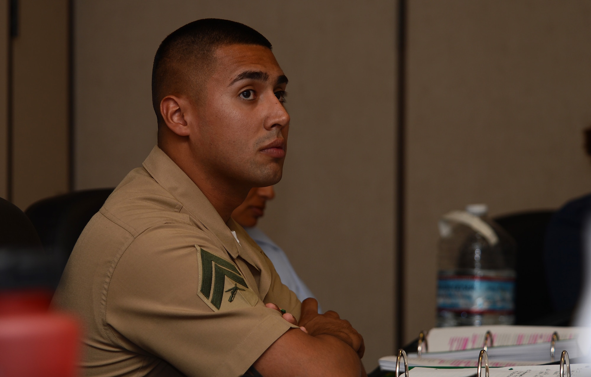 Cpl. Matthew Nevarez, U.S. Marine Corps Security Forces Battalion, Naval Base Kitsap-Bangor, Wash., listens to a lecture July 18, 2016, at the Julius A. Kolb Airman Leadership School at Joint Base Lewis-McChord, Wash. Nevarez is the first Marine to attend the JBLM’s six-week ALS course. (U.S. Air Force photo/Senior Airman Jacob Jimenez) 