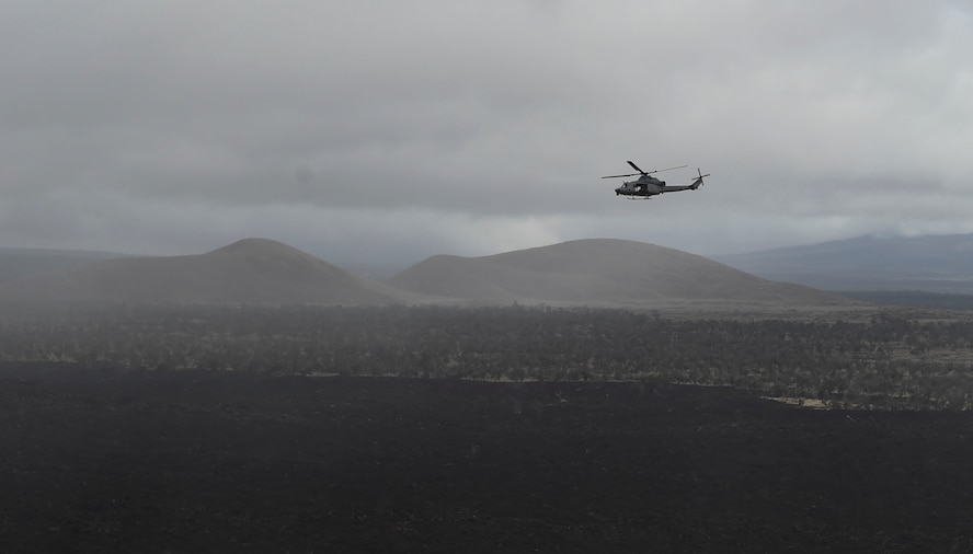 A UH-1Y Venom flies over a live-fire range during RIMPAC at the Pohakuloa  Training Area, Hawaii, July 15, 2016. (U.S. Air Force photo by 2nd Lt. Jaclyn Pienkowski/Released)