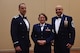 Col. Leonard Kosinksi (, 62nd Airlift Wing Commander, and Chief Master Sgt. Tiko Mazid (right), 62 AW command chief, stand with Tech. Sgt. Danita Welch,  62nd Medical Squadron Health Services Manager, prior to the American Legion Service to America Banquet in Centralia, Wash., July 15, 2016. Welch, a single mother, has fostered more than 50 children whose ages range from 11 months to 18 years old. (U.S. Air Force photo/Staff Sgt. Naomi Shipley)