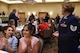 Tech. Sgt. Danita Welch, 62nd Medical Squadron health services manager, stands to be recognized during the American Legion Service to America Banquet in Centralia, Wash., July 15, 2016. Welch received the Spirit of Service Award for her continuous and compassionate efforts as a foster parent to more than 50 children. The American Legion gives the award to service members of each branch of service in recognition of their exemplary efforts in volunteering in their local communities. (U.S. Air Force photo/Staff Sgt. Naomi Shipley)