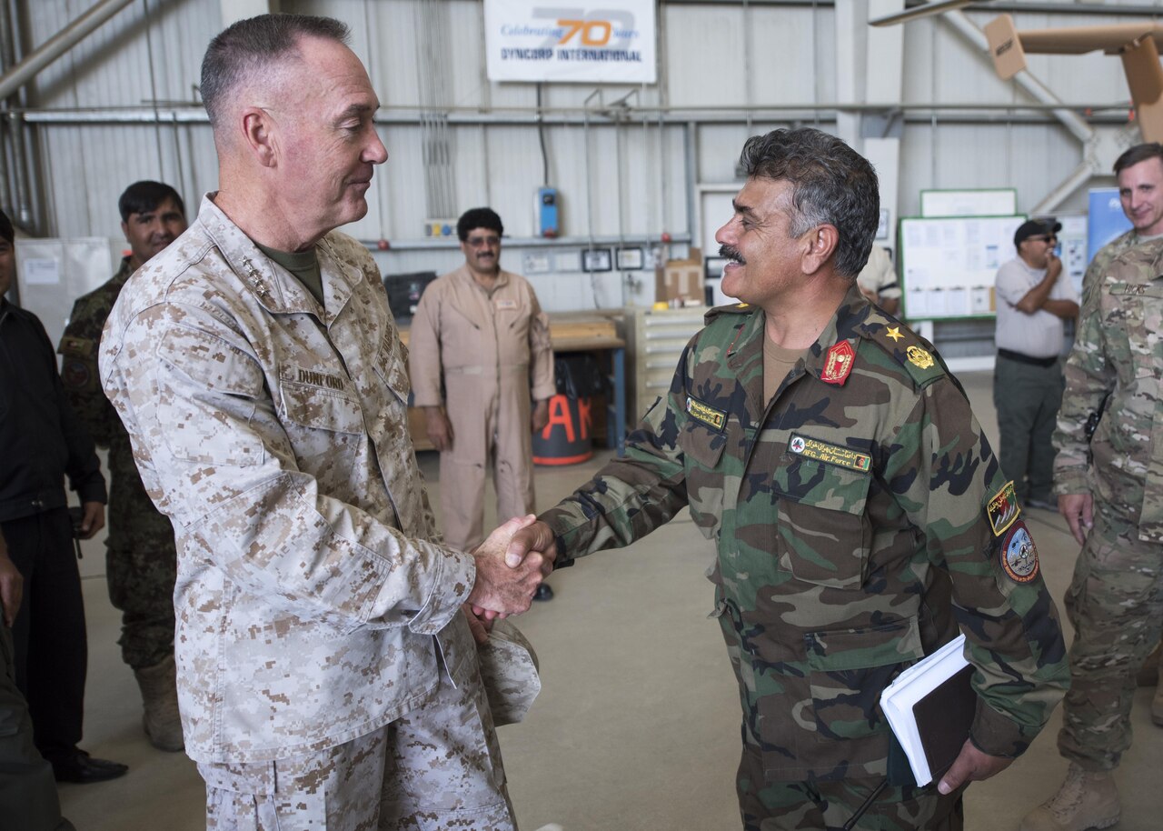 Marine Gen. Joseph F. Dunford Jr., chairman of the Joint Chiefs of Staff, meets with Afghan Air Force Brig. Gen. Eng A. Shafi, during an assessment of the Train, Advise, Assist Command-Air (TAAC-Air), in Kabul, Afghanistan, July 16th, 2016. Dunford met with key leadership and received briefings about the progress of the Afghan air force and its partnership with TAAC-Air as part of his overall assessment of the Resolute Support mission. DoD Photo by Navy Petty Officer 2nd Class Dominique A. Pineiro