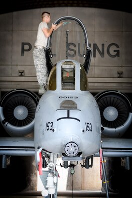 Airman Weston Meyer, 25th Aircraft Maintenance Unit crew chief, cleans the canopy of an A-10 Thunderbolt II assigned to the 25th Fighter Squadron before a combat search and rescue exercise flight at Osan Air Base, Republic of Korea, July 19, 2016. The CSAR flight is part of Exercise Pacific Thunder 16-2, a combined exercise that focuses on enhancing the combat readiness of U.S. and ROK forces through CSAR training. (U.S. Air Force photo by Staff Sgt. Jonathan Steffen/Released) 