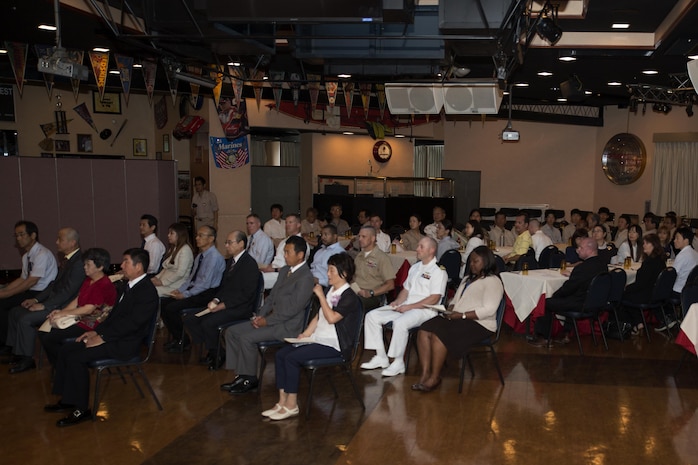 Retirees and guests attend a retirement ceremony at the Landing Zone inside Club Iwakuni at Marine Corps Air Station Iwakuni, Japan, and listen as U.S. Marine Corps Col. Robert V. Boucher, station commanding officer, gives a speech July 15, 2016. The ceremony acknowledged the appreciation of the retirees’ hard work over the years. (U.S. Marine Corps photo by Lance Cpl. Joseph Abrego) 