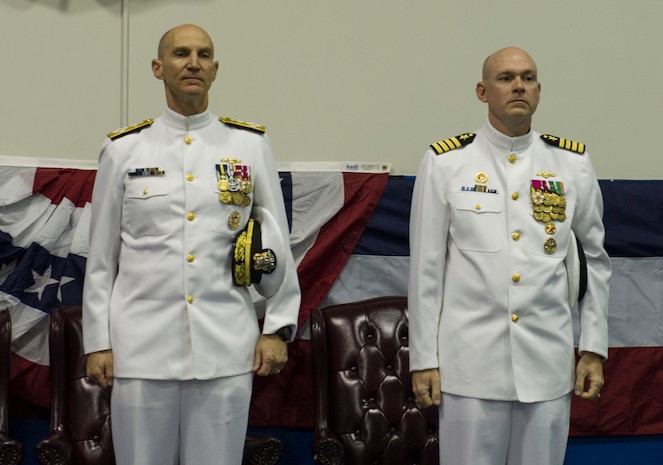 Adm. James F. Caldwell, Jr., Naval Nuclear Propulsion director, left, and Capt. David A. Lott stand in preparation for Lott to assume command of the Naval Nuclear Power Training Unit Charleston during a ceremony July 15, 2016, in the Bowman Center at Joint Base Charleston - Weapons Station, S.C. Lott is coming from the Office of Assistant Secretary of Defense for Nuclear, Chemical and Biological Defense Programs in Washington D.C, where he served as the Office for Countering Nuclear Threats director. (U.S. Air Force photo/Airman 1st Class Kevin West)
