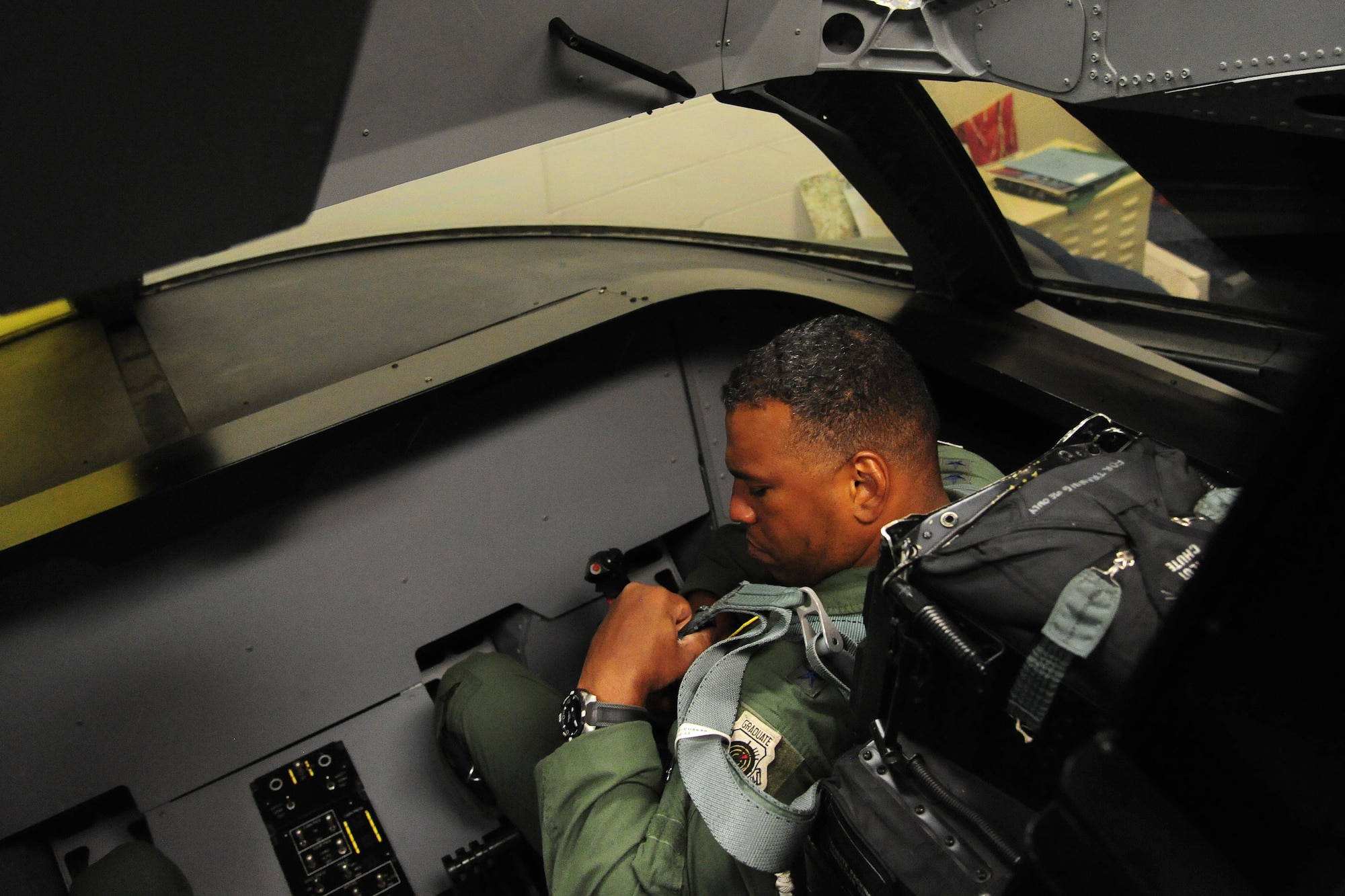 U.S. Air Force Maj. Gen. Richard M. Clark, the 8th Air Force commander, familiarizes himself inside the B-2 Spirit ground egress simulator at Whiteman Air Force Base, Mo., July 13, 2016. The hands-on experience provided the commander with a unique perspective on the B-2 Spirit’s global reach and airpower capability. (U.S. Air Force photo by Senior Airman Joel Pfiester)