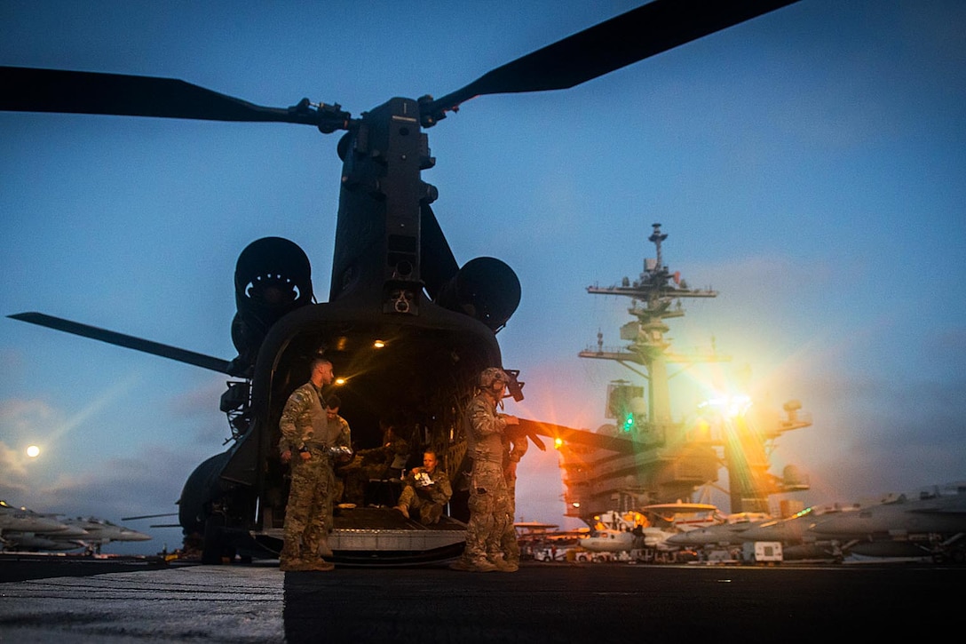 An MH-47G Chinook helicopter sits on the aircraft carrier USS Carl Vinson flight deck in the Pacific Ocean, July 19, 2016. The aircraft carrier is conducting the Tailored Ship's Training Availability and Final Evaluation Problem to prepare for their upcoming deployment. Navy photo by Petty Officer 3rd Class Sean M. Castellano