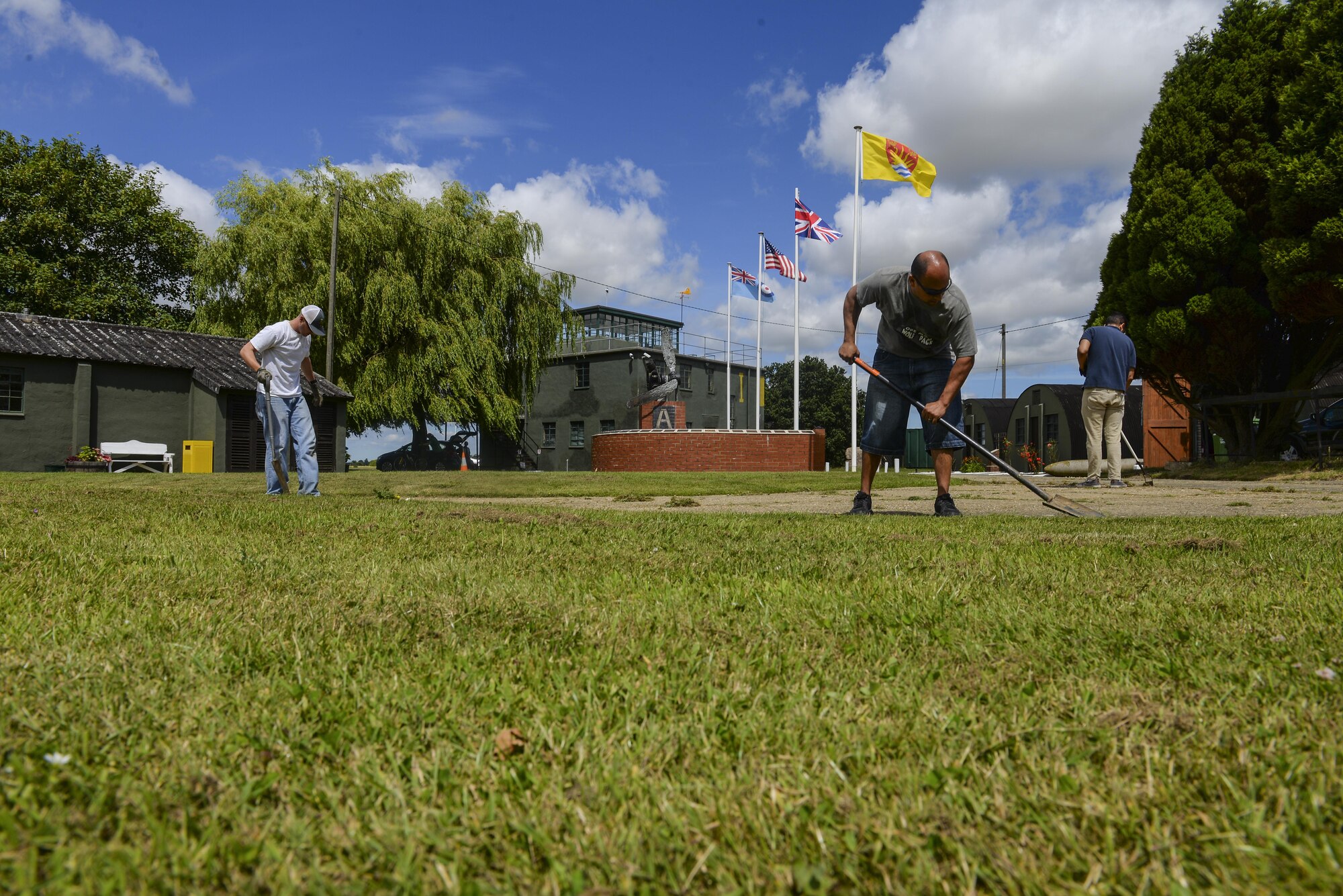 Airmen from Team Mildenhall’s Air Force Sergeants' Association remove weeds from a side walk July 17, 2016, at the RAF Rougham Tower Museum in Bury St. Edmunds, England. During World War II RAF Rougham was home to the U.S. Army Air Force 47th, 322nd, and 94th Bombardment Groups. In 1993 a group of locals banded together to restore and preserve the base after several years of being closed. (U.S. Air Force photo by Staff Sgt. Micaiah Anthony)