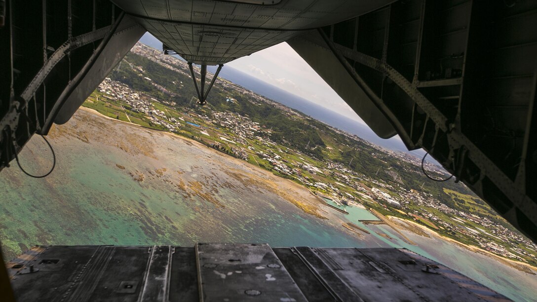 A CH-53E Super Stallion flies over Naha city July 22 in Okinawa, Japan. Marines with Marine Heavy Helicopter Squadron 361, 3rd Marine Aircraft Wing currently deployed with 1st Marine Aircraft Wing as part of the unit deployment program, worked alongside the Japan Self-Defense Force and Okinawa emergency services in Chura-Shima Rescue 2016. The annual exercise hosted by the 15th Brigade, Western Army, Japan Ground Self-Defense Force, trains humanitarian assistance and disaster relief-involved agencies for a swift reaction to a large-scale earthquake and tsunami in Okinawa