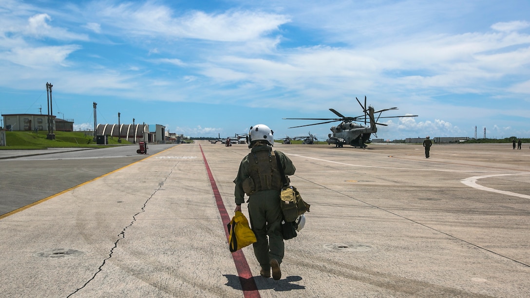 1st Lt. Molly Hurt approaches a CH-53E Super Stallion, Okinawa, Japan Marines with Marine Heavy Helicopter Squadron 361, 3rd Marine Aircraft Wing currently deployed with 1st Marine Aircraft Wing as part of the unit deployment program, worked alongside the Japan Self-Defense Force and Okinawa emergency services in Chura-Shima Rescue 2016. The annual exercise hosted by the 15th Brigade, Western Army, Japan Ground Self-Defense Force, trains humanitarian assistance and disaster relief-involved agencies for a swift reaction to a large-scale earthquake and tsunami in Okinawa. Hurt is a CH-53E pilot wit Marines with Marine Heavy Helicopter Squadron 361, 3rd Marine Aircraft Wing currently deployed with 1st Marine Aircraft Wing as part of the unit deployment program.