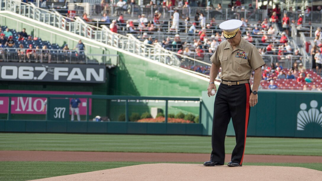 Commandant of the Marine Corps Gen. Robert B. Neller prepares to throw a baseball during a baseball game at Nationals Park, Washington, D.C., July 20, 2016. Neller threw the ceremonial first pitch at the Washington National’s annual game honoring the Marine Corps. 