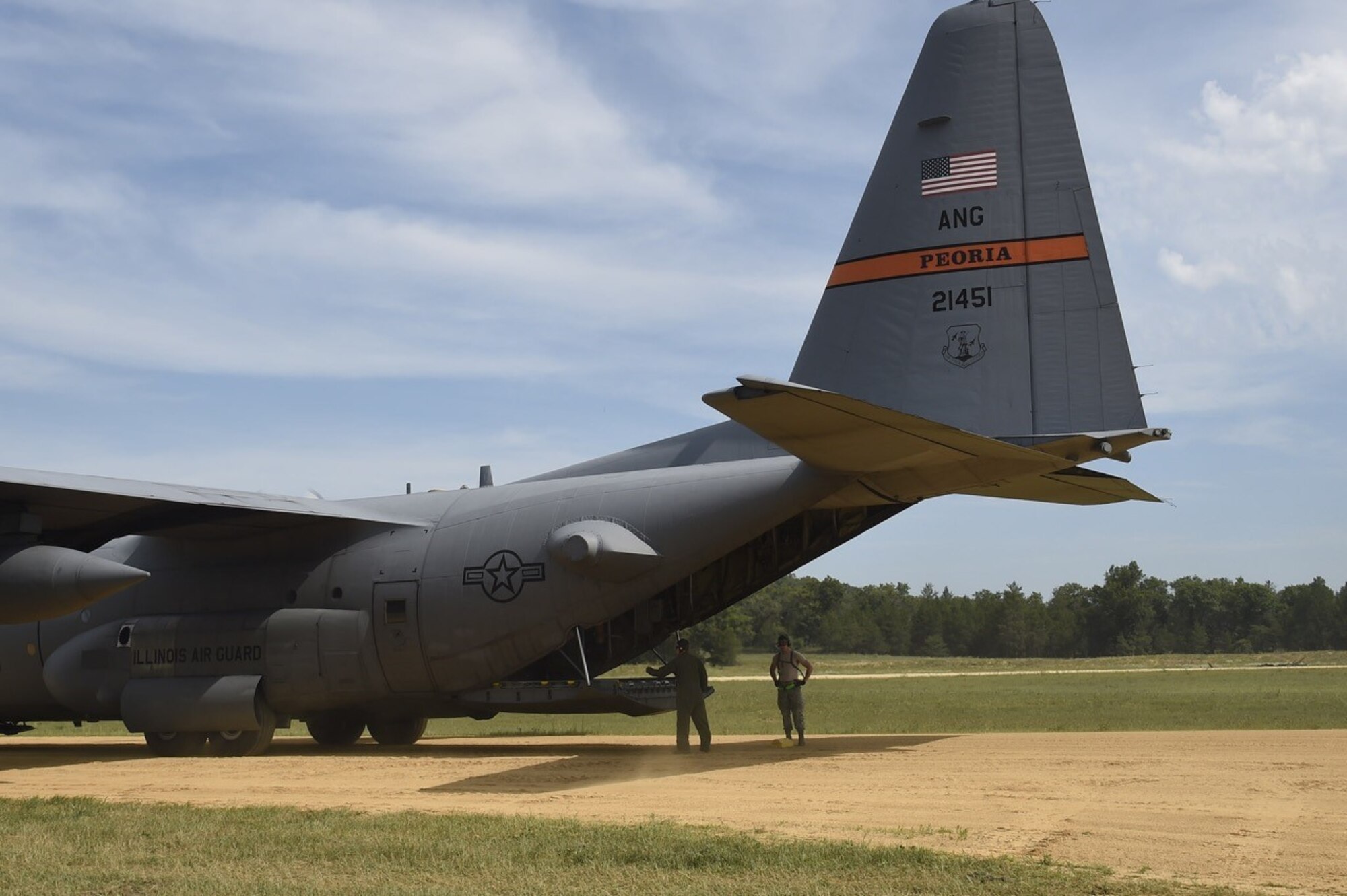 An Illinois Air National Guard C-130 aircraft form the 182nd Airlift Wing awaits loading on an austere airfield during Joint Exercise Turbo Distribution at Fort McCoy, Wis., July 219, 2016. During the exercise, approximately 130 Airmen from the 621st Contingency Response Group, 50 Soldiers from the 689th Transportation Detachment Rapid Port Opening Element, Joint Base Langley-Eustis, Va., and a support team from the Defense Logistics Agency deployed as part of a Joint Task Force-Port Opening. 