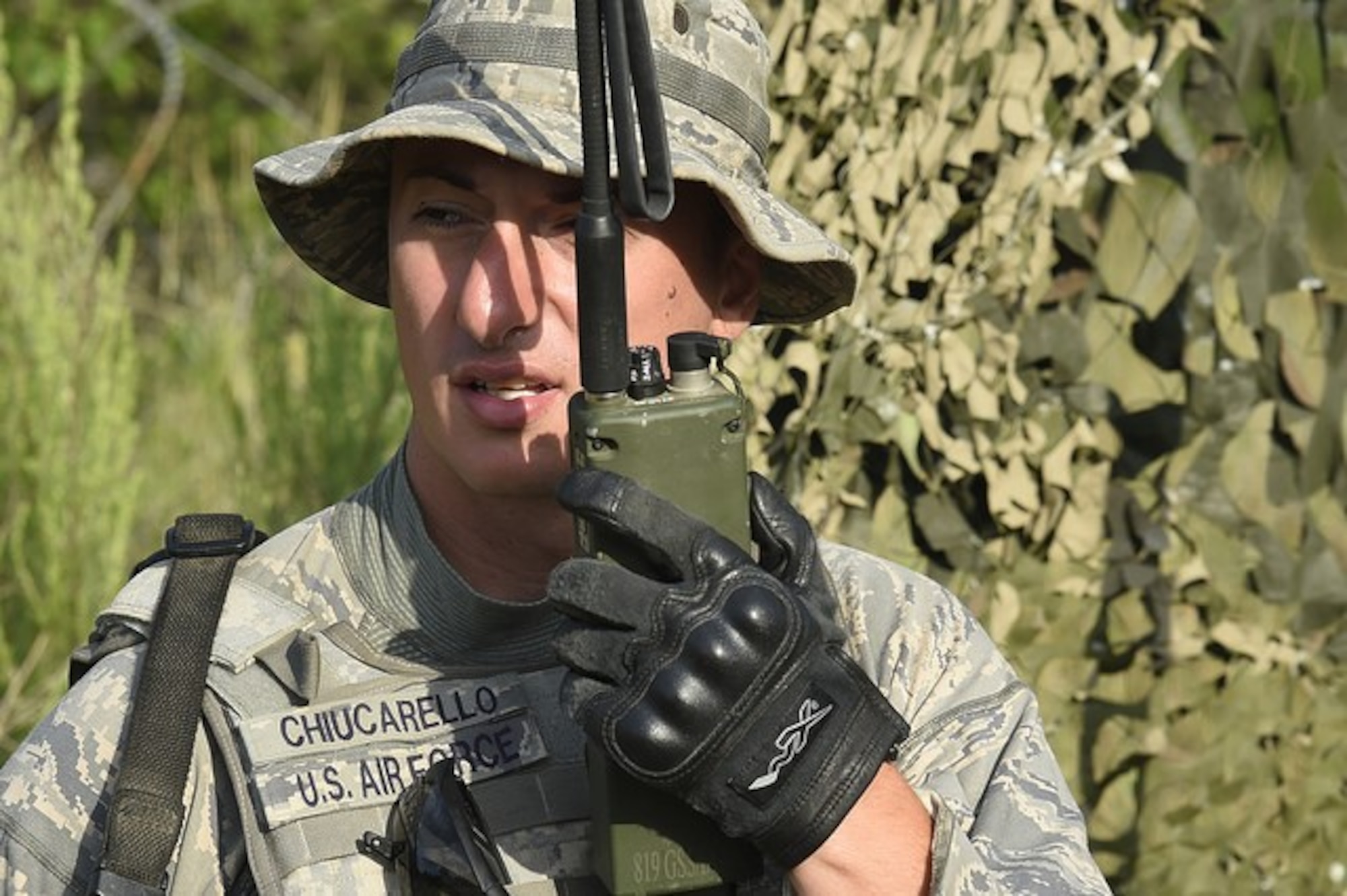 Senior Airmen Matthew Chiucarello, 621st Contingency Response Group, Joint Base McGuire-Dix-Lakehurst, N.J., maintains communication via radio during Joint Exercise Turbo Distribution at Fort McCoy, Wis., July 19, 2016. During the exercise, approximately 130 Airmen from the 621st Contingency Response Group, 50 Soldiers from the 689th Transportation Detachment Rapid Port Opening Element, Joint Base Langley-Eustis, Va., and a support team from the Defense Logistics Agency deployed as part of a Joint Task Force-Port Opening. 