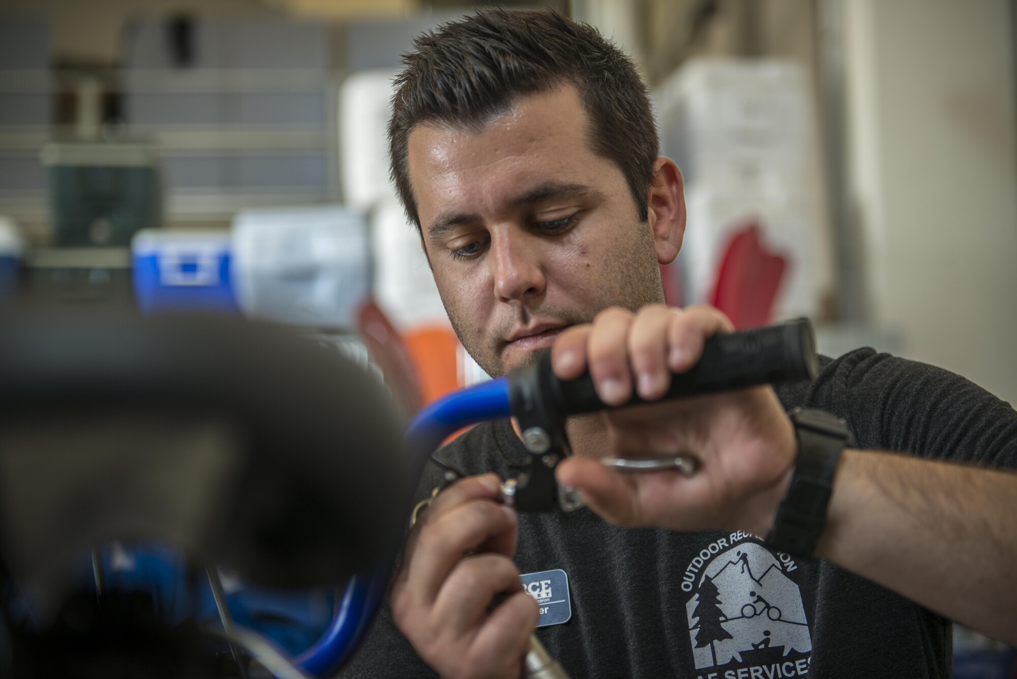 Todd Spencer, 31st Force Support Squadron Outdoor Recreational equipment maintenance professional, fixes a customer’s bicycle breaks July 20, 2016, at Aviano Air Base, Italy. Outdoor Recreation offers a wide range of rental equipment and can perform routine maintenance on skis and snowboards. (U.S. Air Force photo by Airman 1st Class Cory W. Bush/Released)
