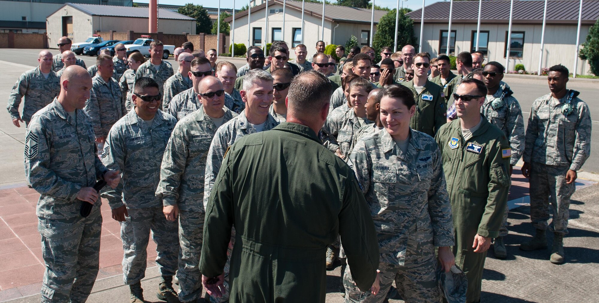 Airmen approach Brig. Gen. Jon T. Thomas, 86th Airlift Wing commander, after his “fini flight” July 21, 2016, at Ramstein Air Base, Germany. Airmen traditionally come out to greet their commanders after their final flight. (U.S. Air Force photo/Airman 1st Class Lane T. Plummer)
