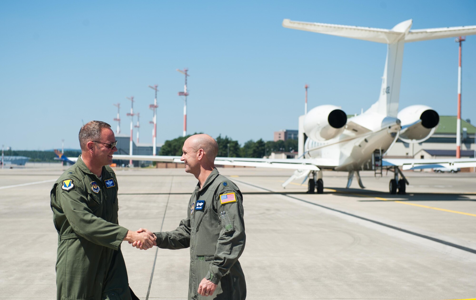 Brig. Gen. Jon T. Thomas, 86th Airlift Wing commander, greets Lt. Col. Derek Gallagher, 76th Airlift Squadron commander, before taking off for his final flight as the 86th AW commander July 19, 2016, at Ramstein Air Base, Germany. Thomas has served in the 86th AW for one year and will be moving on to Scott Air Force Base, Illinois. (U.S. Air force photo/Airman 1st Class Lane T. Plummer)