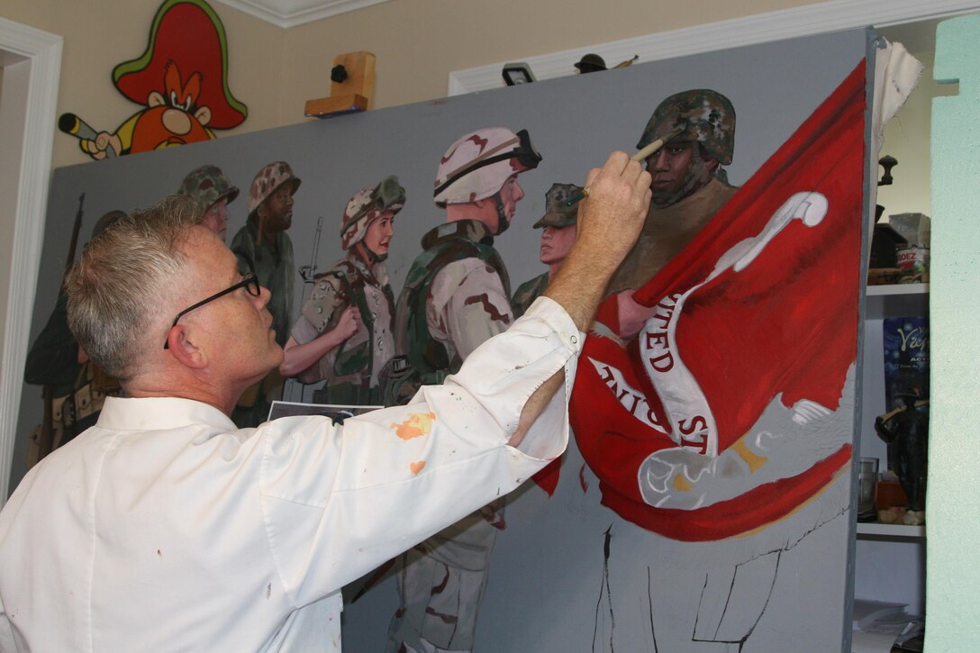 Kristopher Battles, a veteran Marine combat artist, works on the painting he was commissioned to paint for the Centennial celebration of the U.S. Marine Corps Reserves in his Spotsylvania, Va. studio July 18.