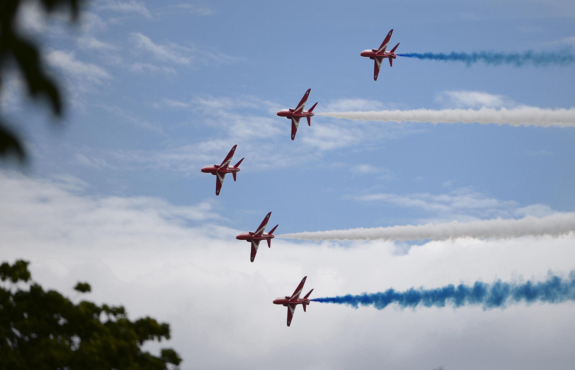 The Royal Air Force Red Arrows Acrobatic Team perform during the Families and Friends Day celebration at Royal Air Force Marham, England, July 21. The event celebrated RAF Marham's 100th anniversary and welcomed Airmen from RAFs Lakenheath and Mildenhall, as well as their families and local dignitaries to enjoy the festivities. (U.S. Air Force photo/Staff Sgt. Emerson Nuñez)