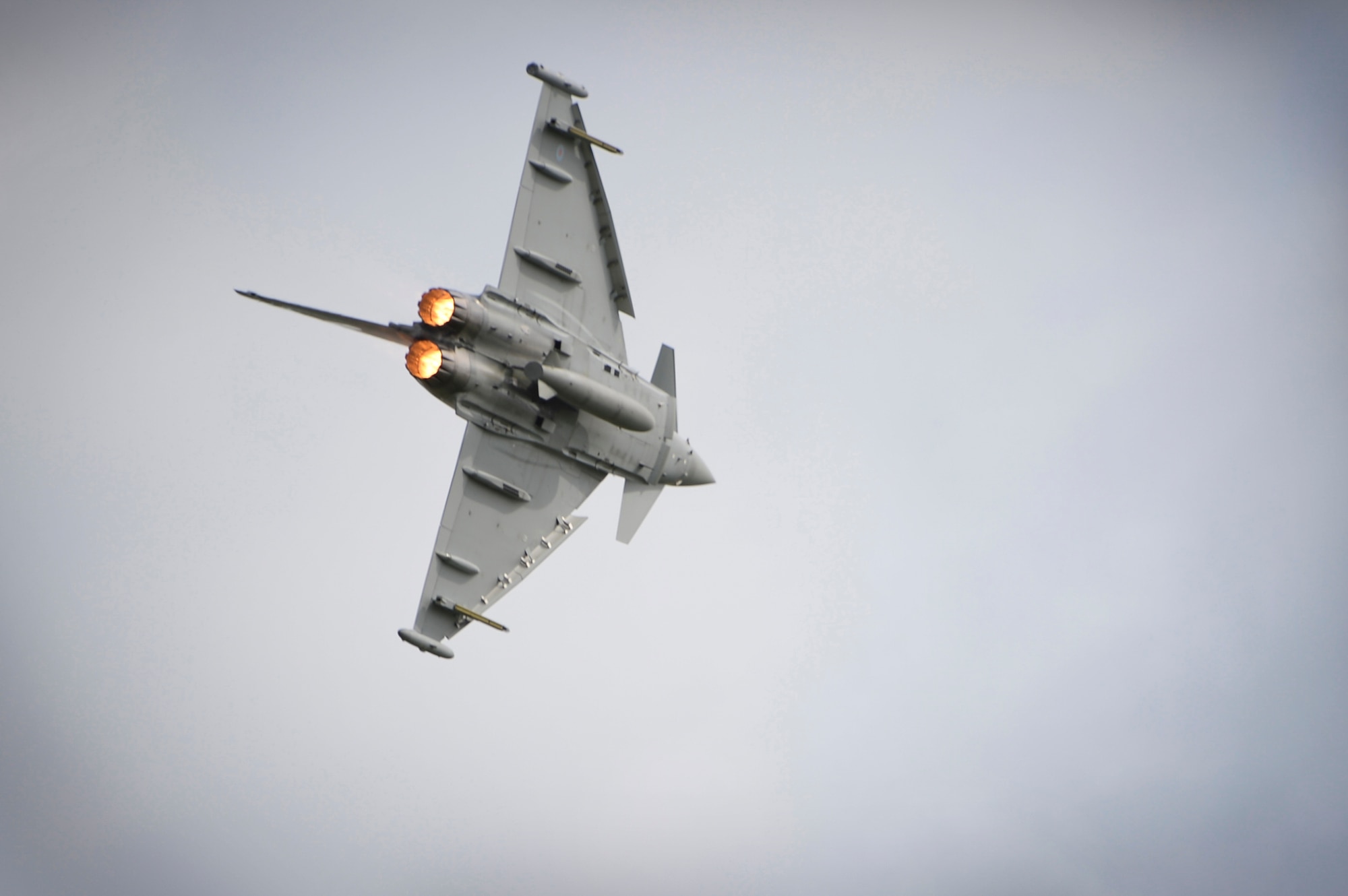 A Royal Air Force Typhoon FGR4 performs during a demonstration at the Families and Friends Day celebration at RAF Marham, England, July 21. The event celebrated RAF Marham's 100th anniversary and welcomed Airmen from RAFs Lakenheath and Mildenhall, as well as their families and local dignitaries to enjoy the festivities. (U.S. Air Force photo/Staff Sgt. Emerson Nuñez)