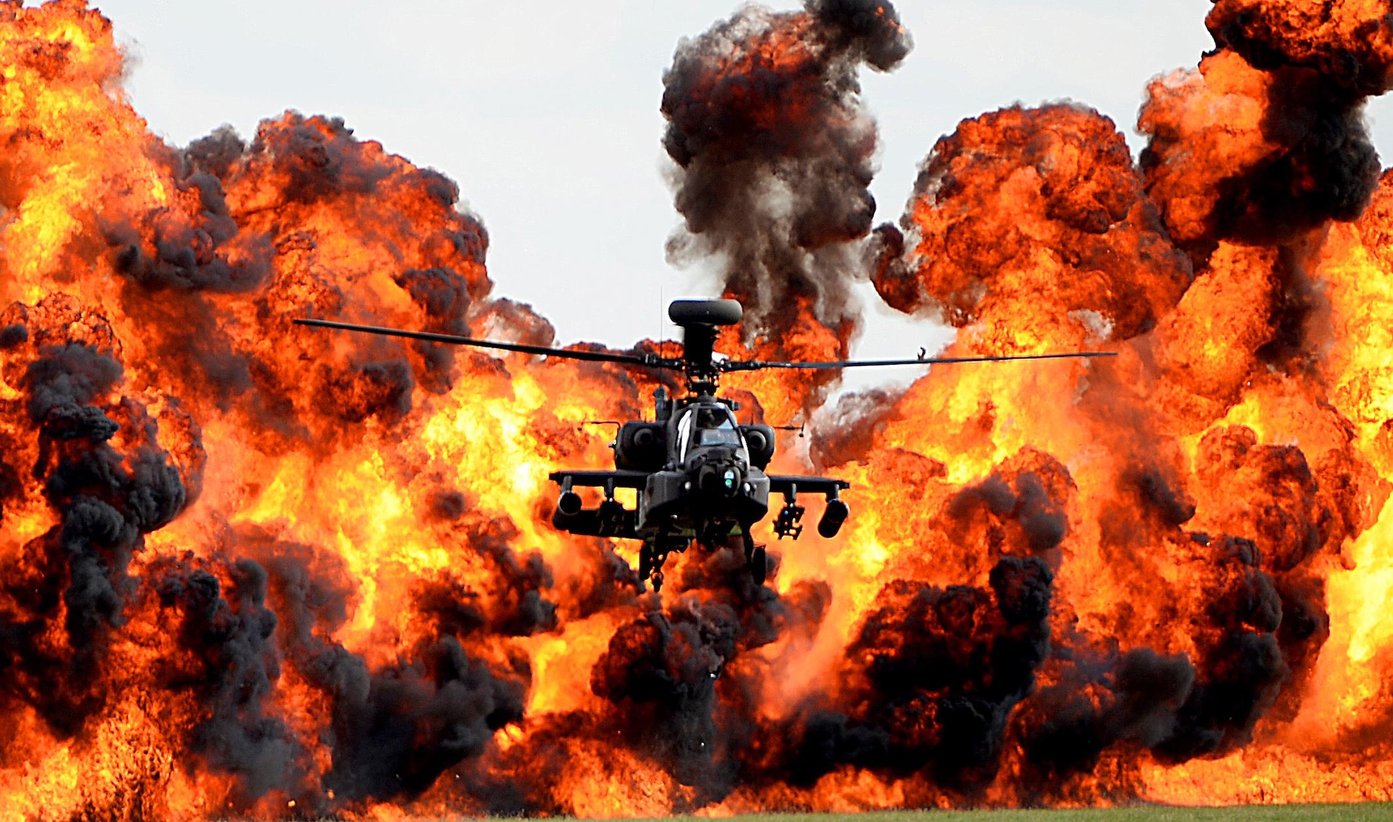 A Royal Air Force Apache finishes its demonstration during the Families and Friends Day celebration at RAF Marham, England, July 21. Airmen from RAFs Lakenheath and Mildenhall were invited to celebrate RAF Marham's 100th anniversary and to continue building a closer partnership between bases. (U.S. Air Force photo/Staff Sgt. Emerson Nuñez)