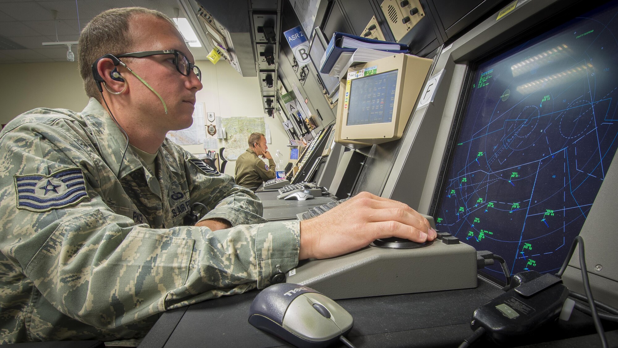 Tech. Sgt. Derek Pace, 31st Operations Support Squadron air traffic control watch supervisor, scans the surrounding airspace using the Standard Terminal Automation Replacement System July 19, 2016, at Aviano Air Base, Italy. The information displayed on STARS is part of a grid network of digital airport surveillance radars that track all aircraft flying over the European continent. (U.S. Air Force photo by Airman 1st Class Cory W. Bush/Released)