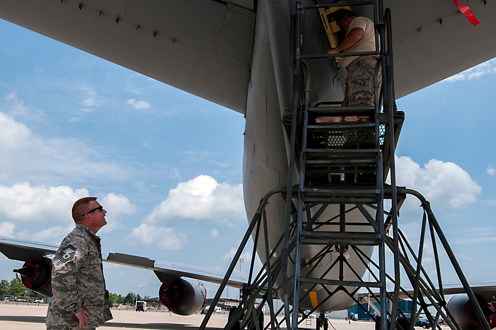 Senior Master Sgt. Michael Young, 434th Maintenance Group quality assurance inspector, looks on as two crew chiefs from the 434th Aircraft Maintenance Squadron replace a damaged elevator snubber July 13, 2016 at Grissom Air Reserve Base, Ind. The 434th MXG QA section was recently awarded the 2015 Air Force Reserve Command Quality Assurance Section of the Year Award. (U.S. Air Force photo/Senior Airman Dakota Bergl) 