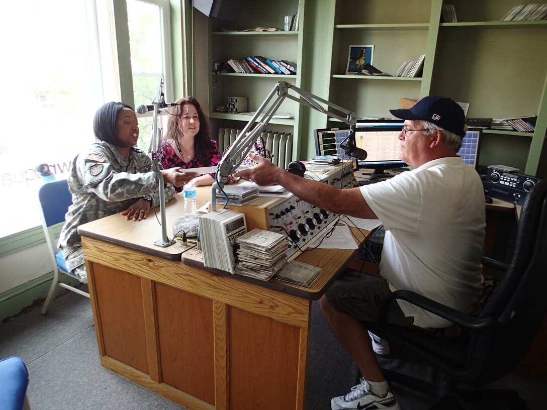 Maj. Satomi Mack-Martin, public affairs officer from 3d Medical Command Deployment Support in Atlanta, Ga., and Elizabeth Monaco, executive director for the Chenango United Way, speak with local radio stations to promote Greater Chenango Cares, July 18, 2016.   Greater Chenango Cares is one of the Innovative Readiness Training events which provides real-world training in a joint civil-military environment while delivering world class, no-cost medical care to the people of Chenango County, N.Y., from July 15-24.