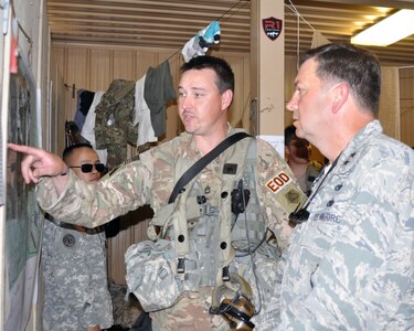 Massachusetts Army National Guard Sgt. 1st Class Michael Rockett, a non-commissioned officer assigned to the 387th Explosive Ordnance Disposal Co. based at Camp Edwards, Cape Cod, Mass., explains a training objective to Massachusetts Air National Guard Maj. Gen. Gary Keefe, the Mass. National Guard adjutant general, during training at the Army’s Joint Readiness Training Center, Fort Polk, Louisiana,  July 20, 2016. 