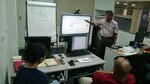 Richard Taitague shows DLA Distribution Guam employees how to navigate USAJOBS and how to use the site to highlight their best skills.